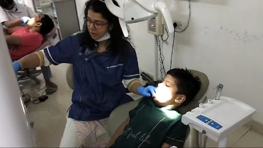 Dr. Amrata Srivastava treating a young patient with care
